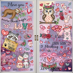Close-up of Valentine's Day window stickers with cartoon animals on a glass door