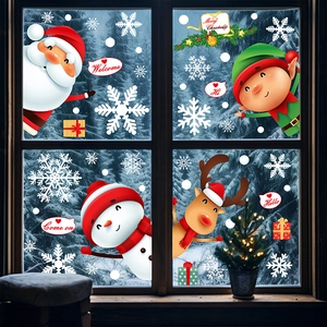 Christmas window decals with Santa Claus, reindeer, and snowflakes on a glass window background