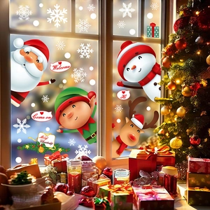 Detail of Christmas window stickers featuring Santa and reindeer in a festive home setting