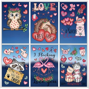 Close-up of six cartoon animal stickers with blue backgrounds and romantic heart elements