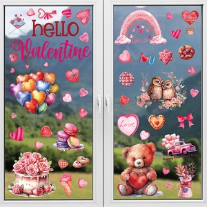 Close-up of Valentine glass window clings with hearts, teddy bears and birds