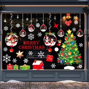 Detail view of Merry Christmas window decals with Santa and snowflake electrostatic stickers