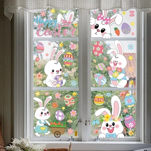 Detailed view of colorful Easter bunny and egg static window clings on white window panes