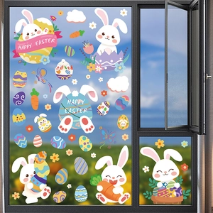 Close-up of Happy Easter window clings with cartoon rabbits and colorful eggs on glass