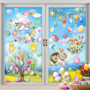 Colorful Happy Easter window stickers with rabbit and eggs on glass against a blue sky