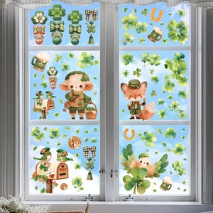 St. Patrick's Day window decals with clover, foxes, and birds on a glass window scene