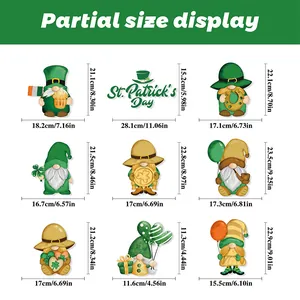 Size chart for St. Patrick's Day window decals showing clover and gnome dimensions