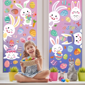 Girl in bunny ears with Happy Easter window decals featuring rabbits and eggs