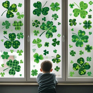 Close-up of Saint Patrick's Day shamrock window stickers with patterns on a glass pane