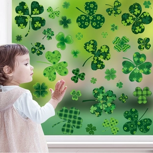 Detail of St. Patrick's Day clover window stickers with diverse green patterns on glass