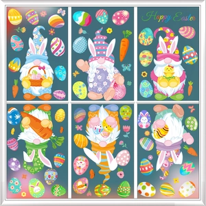 Detail of Easter gnome window clings with colorful eggs and carrots on window glass