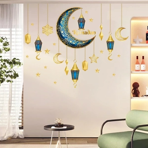 Detail of Ramadan wall stickers featuring golden crescent moon and lanterns on living room wall