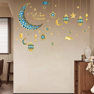 Blue and gold Eid Mubarak 3D moon stickers with stars and lanterns on a beige wall