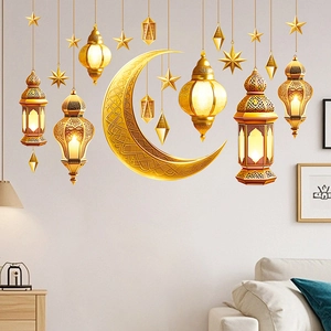 Close-up of golden Ramadan wall stickers featuring mirror lanterns and crescent moon decals