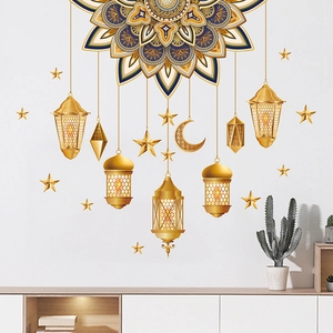 Detailed view of golden Ramadan wall stickers with mandala moon and lanterns on white wall