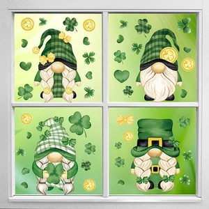 St. Patrick's Day window clings featuring green gnomes and clovers on a white frame