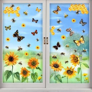 Sunflower and butterfly static window clings on glass with garden background view
