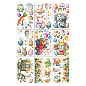 Set of 9 Easter window stickers featuring cartoon bunnies, eggs, and Happy Easter signs