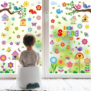 Detail of Hello Spring static window clings featuring colorful birds and floral designs