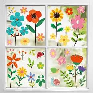 Colorful floral window clings set with cartoon flowers, snails and ladybugs on a white window