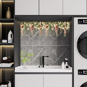 Detail of rose vine window stickers showing pink floral patterns on a bathroom wall