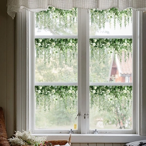 Detail of static cling rose vine window stickers on glass for home decoration