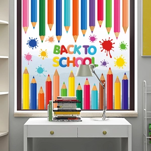 Colorful static school stickers with pencils and rainbow text on window glass