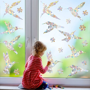 Macro detail of iridescent hummingbird window film with rainbow refraction effect