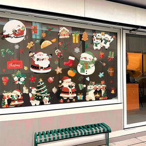 Detailed Christmas window decals showing Santa, snowmen, and trees on glass