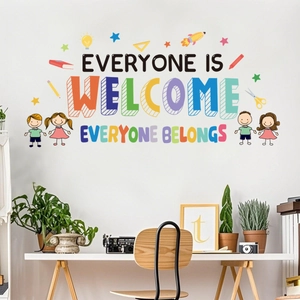 Colorful wall sticker showing Everyone Is Welcome slogan in a cozy classroom setting
