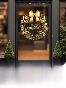 Detail view of golden Christmas wreath window sticker with dimensions 37x39cm