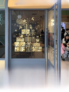 Gold static Christmas tree window decal with gift box and reindeer details for shops