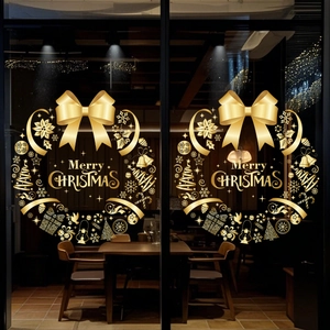 Golden Christmas wreath window sticker with bow and snowflake motifs for festive decor