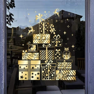 Detail of golden Christmas window stickers with festive gift box and reindeer motifs