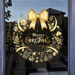 Detail of golden Merry Christmas static window sticker with snowflake and ribbon wreath