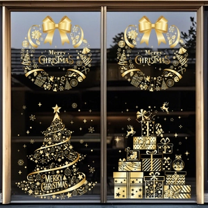 Detail of gold Christmas tree and wreath window decals with Merry Christmas text