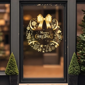 Golden Christmas wreath window cling with Merry Christmas lettering for festive glass decor