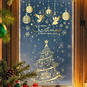 Close-up of golden Christmas tree and snowflake window stickers on frosted glass
