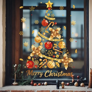 Detail of gold and red static window decals forming a Christmas tree with Merry Christmas text