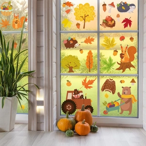 Autumn Thanksgiving window stickers with squirrel, hedgehog, and owl on glass surface
