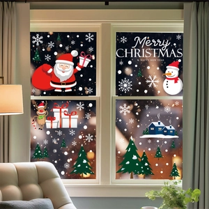 Christmas window decals with Santa and snowman on glass in a cozy holiday home interior