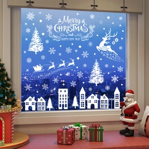 White Christmas window static clings featuring reindeer, snowflakes and festive city skyline