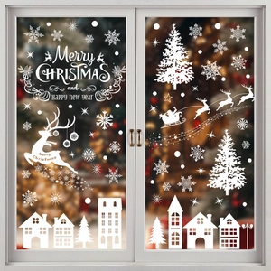 White Christmas window decals featuring reindeer silhouettes and festive snowflakes decor