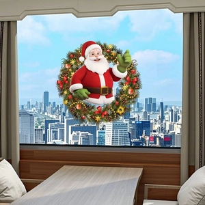 Dettaglio dell'adesivo statico ghirlanda Babbo Natale su vetro con vista città