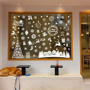 White Christmas window static stickers with reindeer and snowflakes on a glass window