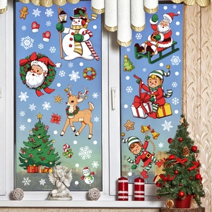 Close-up of festive Christmas window decals featuring Santa, snowman and reindeer themes