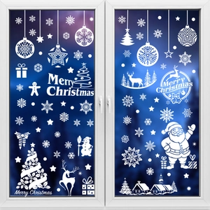 White Christmas window decals with snowflakes and Merry Christmas text on glass