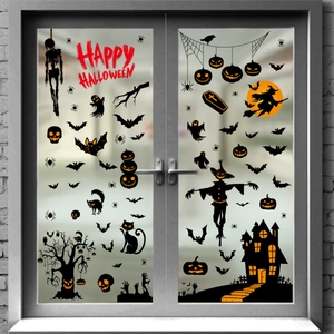 Halloween window stickers featuring ghosts, pumpkins, and a haunted house on glass doors