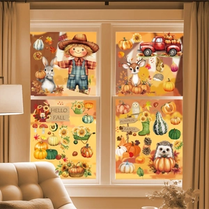 Detail of Thanksgiving window clings with pumpkins and scarecrows on a glass pane