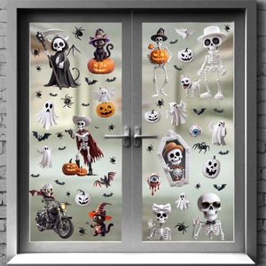 Detailed view of Halloween stickers featuring skeletons and ghosts on a glass window
